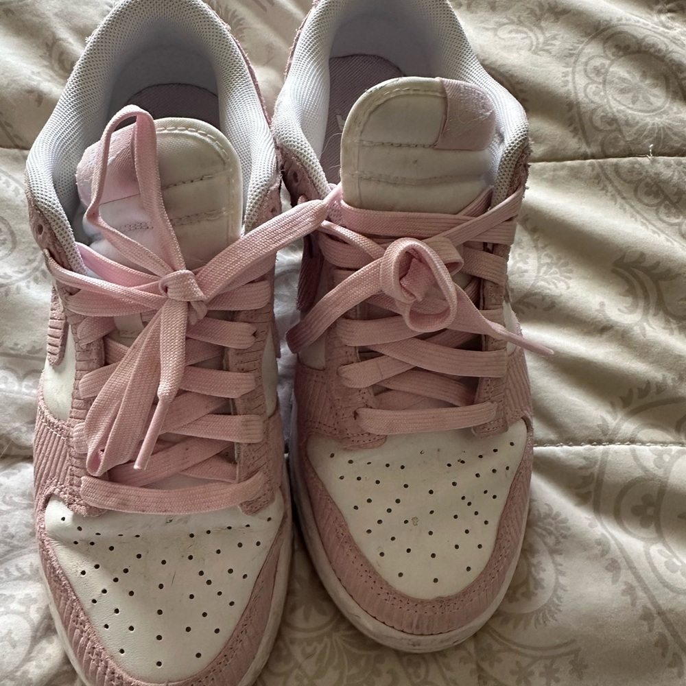 Women's Pink and White Nike sneakers